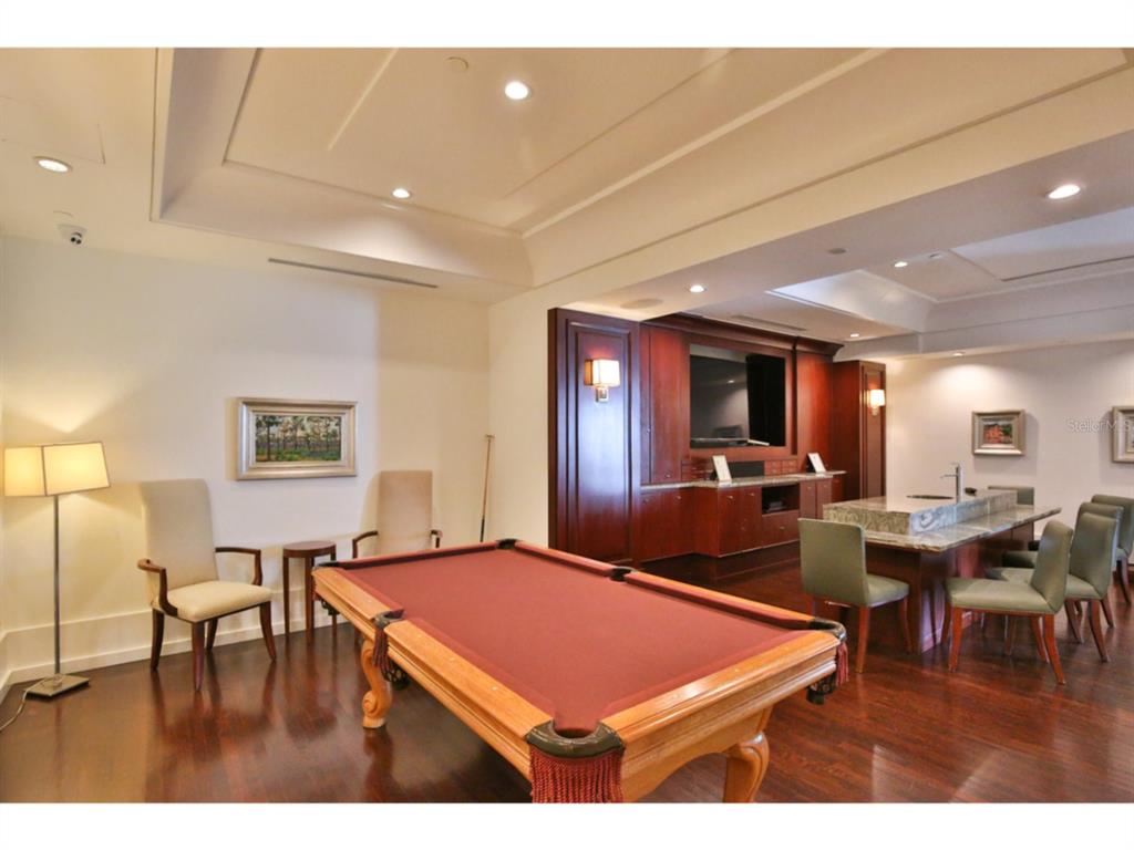 1350 Main Street, Unit 204 Sarasota, FL 34236 - Photo 19 of 22 a room with furniture pool table and a flat screen tv