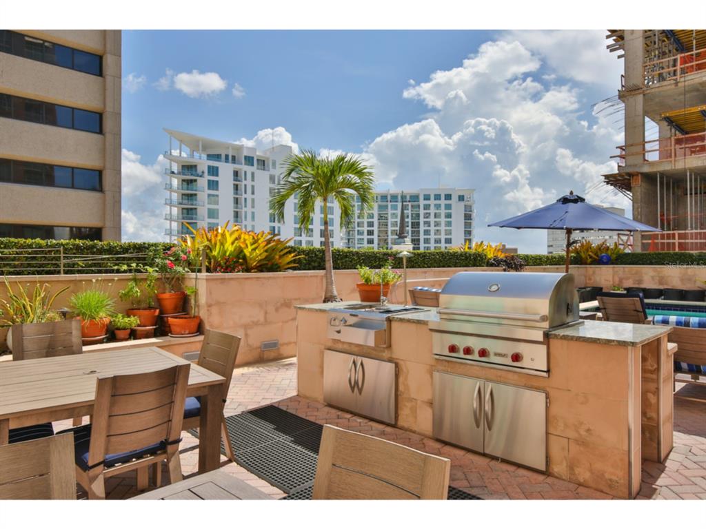 1350 Main Street, Unit 204 Sarasota, FL 34236 - Photo 22 of 22 a view of a chairs and table in the terrace