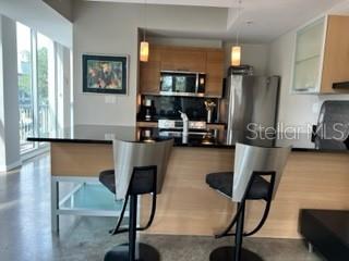 1350 Main Street, Unit 204 Sarasota, FL 34236 - Photo 9 of 22 a view of a workspace with furniture and a window