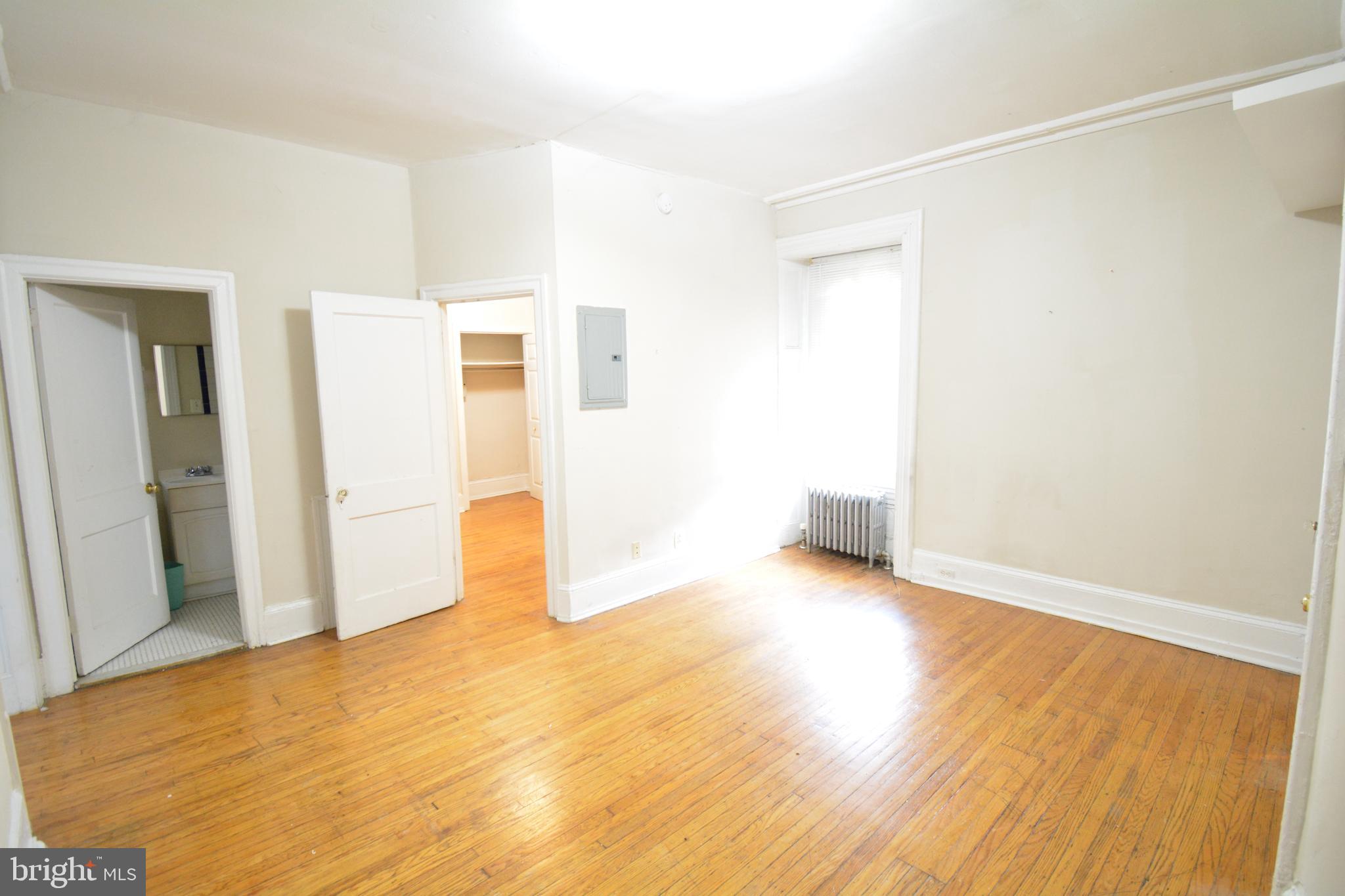 235 West Rittenhouse Street, Unit 1B Philadelphia, PA 19144 - Photo 3 of 9 a view of empty room with wooden floor