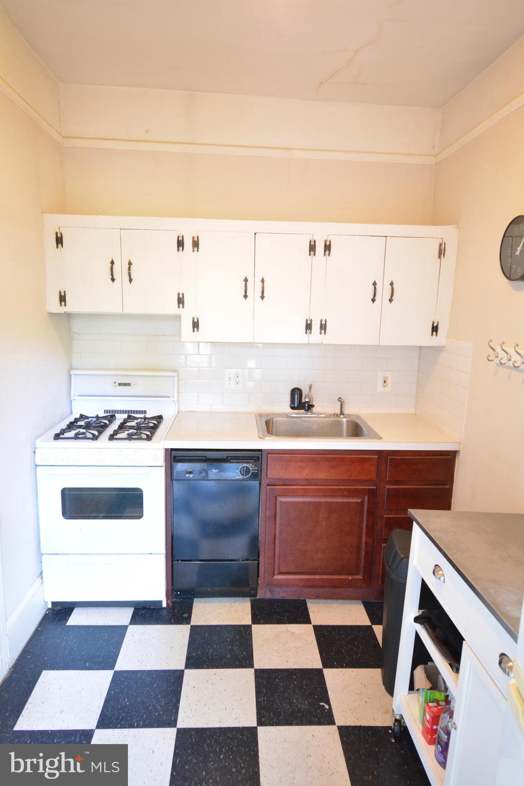 235 West Rittenhouse Street, Unit 1B Philadelphia, PA 19144 - Photo 6 of 9 a kitchen with stainless steel appliances and cabinets