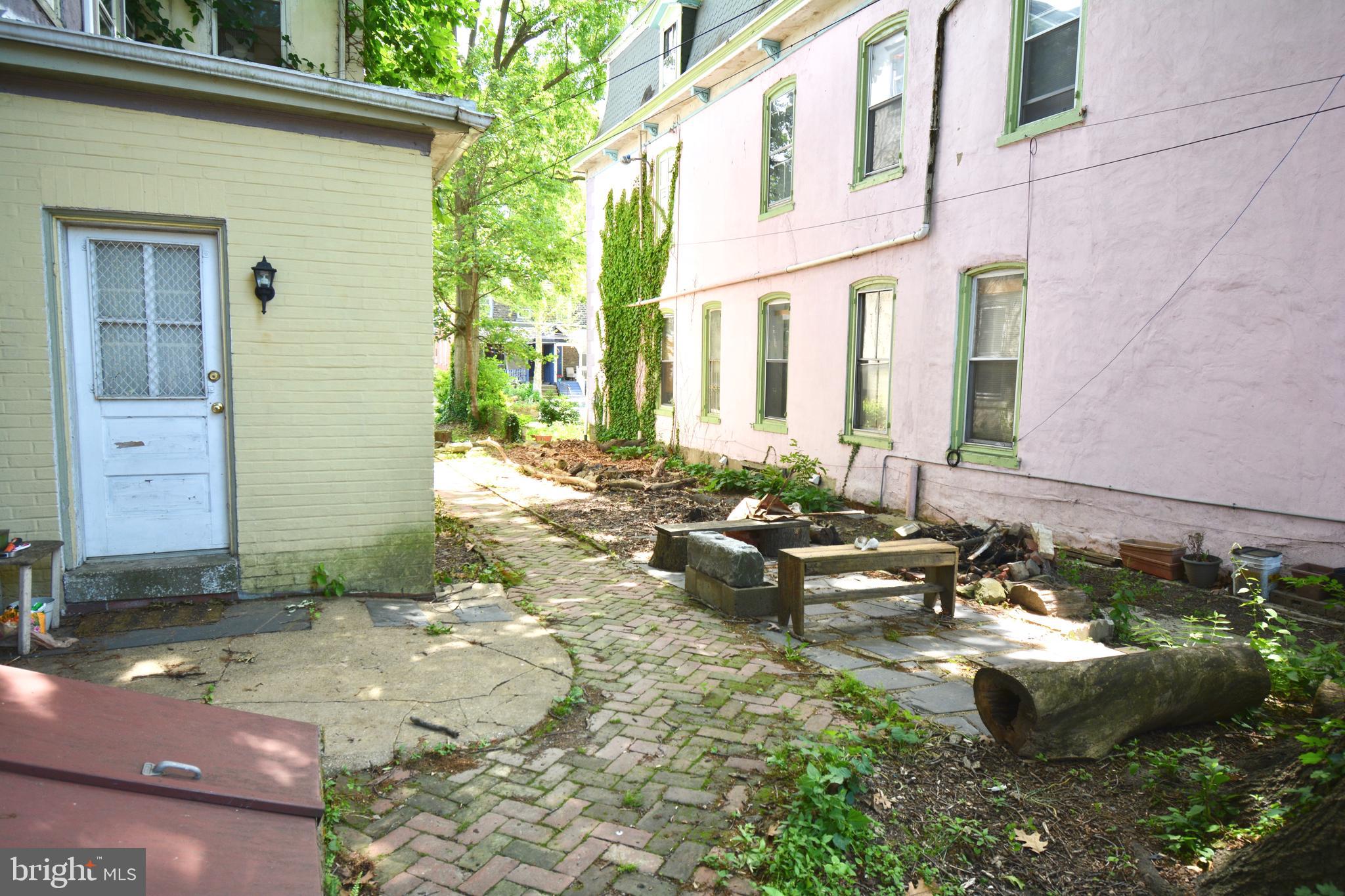 235 West Rittenhouse Street, Unit 1B Philadelphia, PA 19144 - Photo 9 of 9 a backyard of a house with outdoor seating