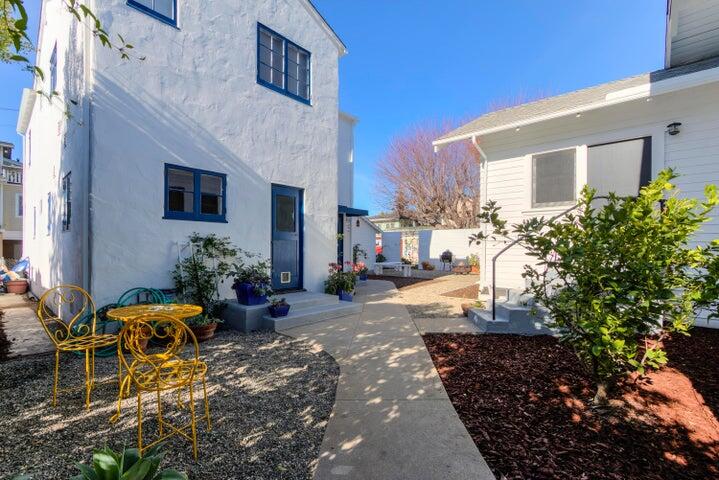 1917 Bath Street Santa Barbara, CA 93101 - Photo 2 of 2 a view of a house with backyard sitting area and garden
