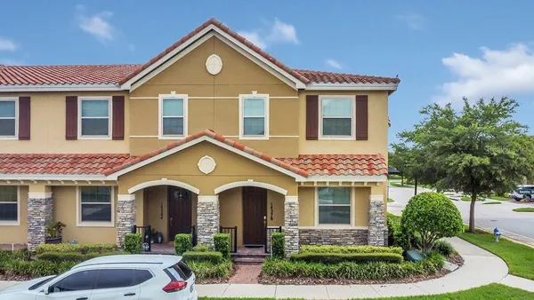 a front view of a house with garden