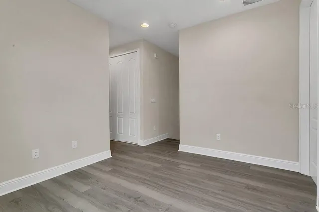 a view of an empty room with a window