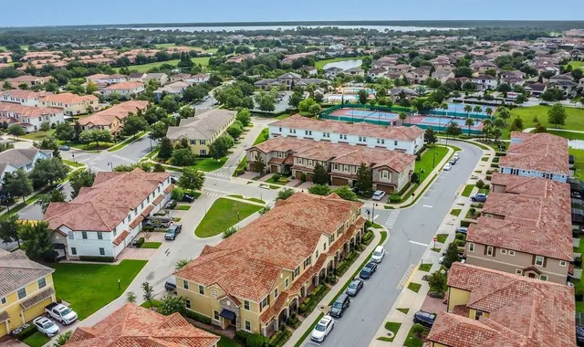 an aerial view of residential houses and outdoor space