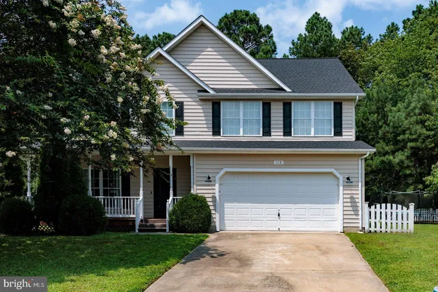 front view of a house with a garden