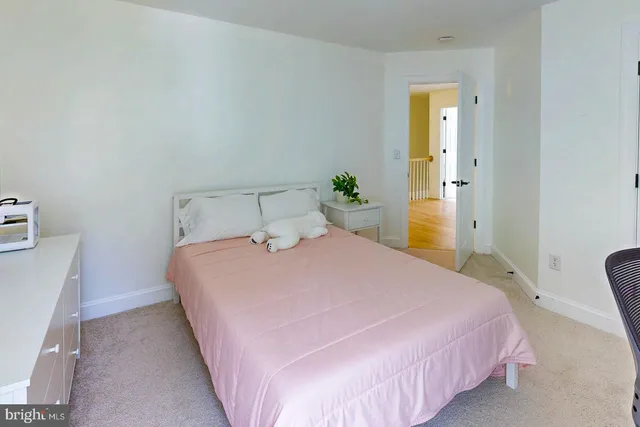 a bedroom with a bed and a closet