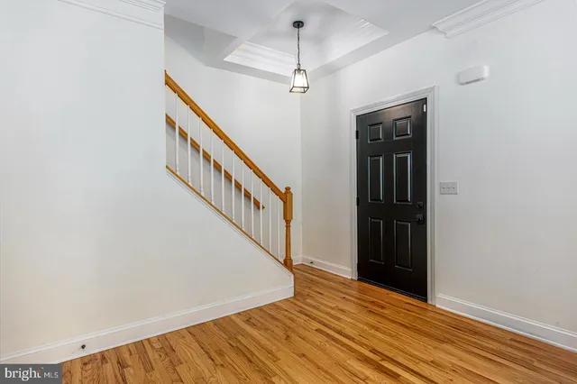 a view of an entryway with wooden floor