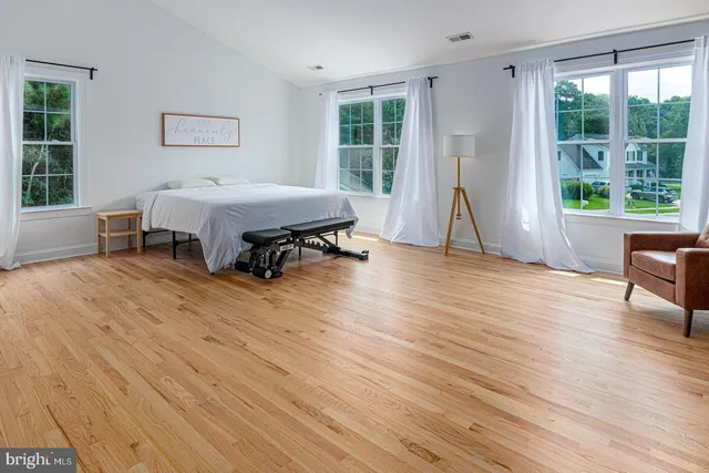 a bed room with a bed and a window