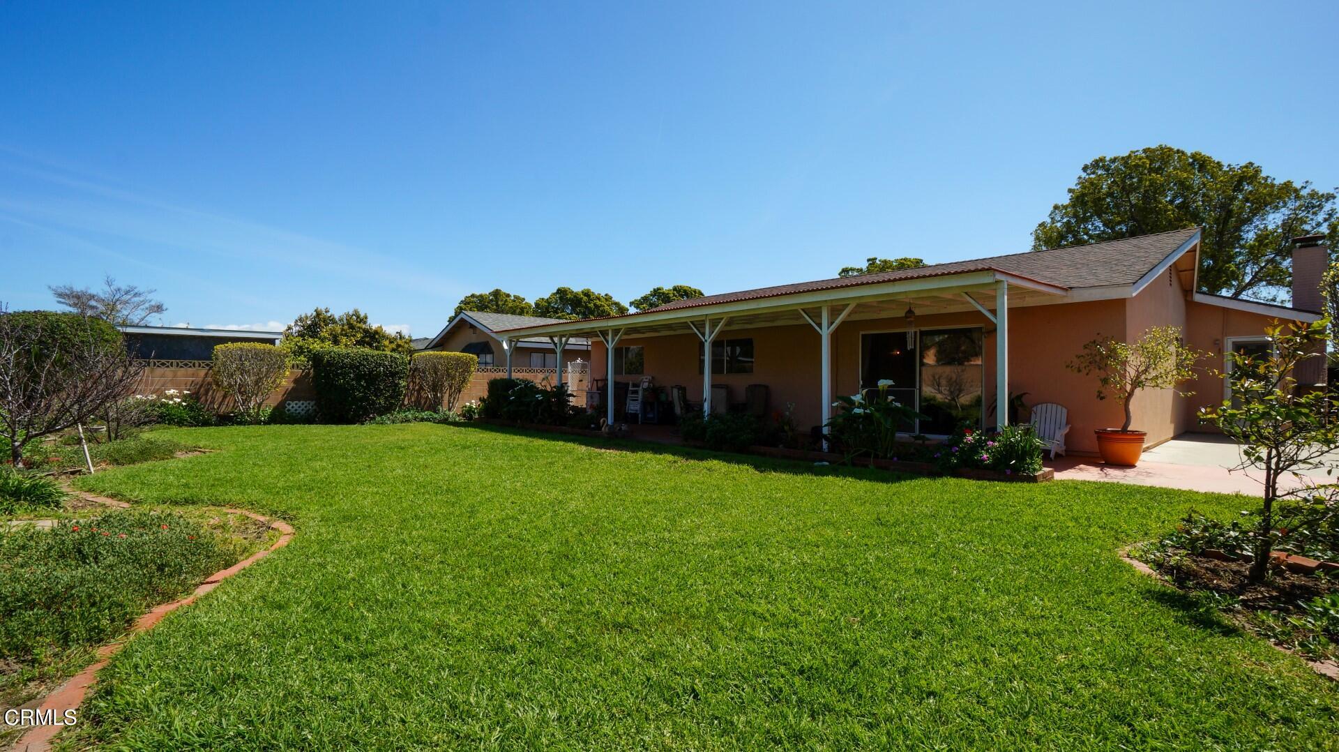 1121 Yale Street Oxnard, CA 93033 - Photo 19 of 22 a view of a house with backyard and porch