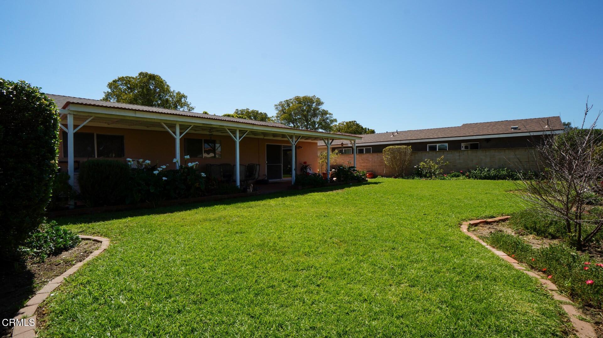 1121 Yale Street Oxnard, CA 93033 - Photo 21 of 22 a view of house with yard and green space