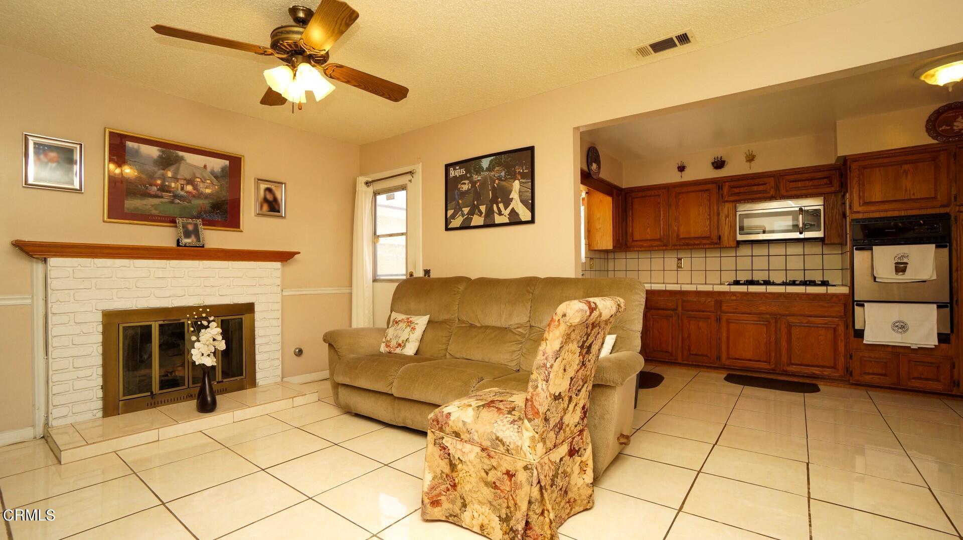 1121 Yale Street Oxnard, CA 93033 - Photo 7 of 22 a living room with furniture and a fireplace