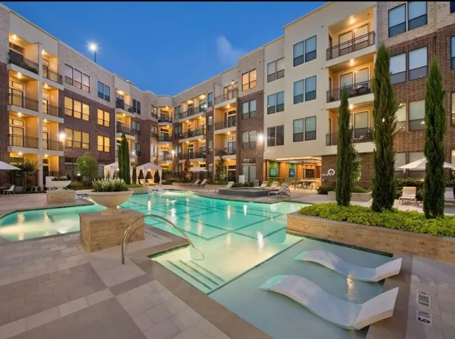 a building view with swimming pool and outdoor seating