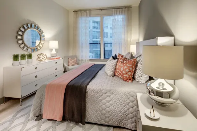 a bedroom with a bed and window