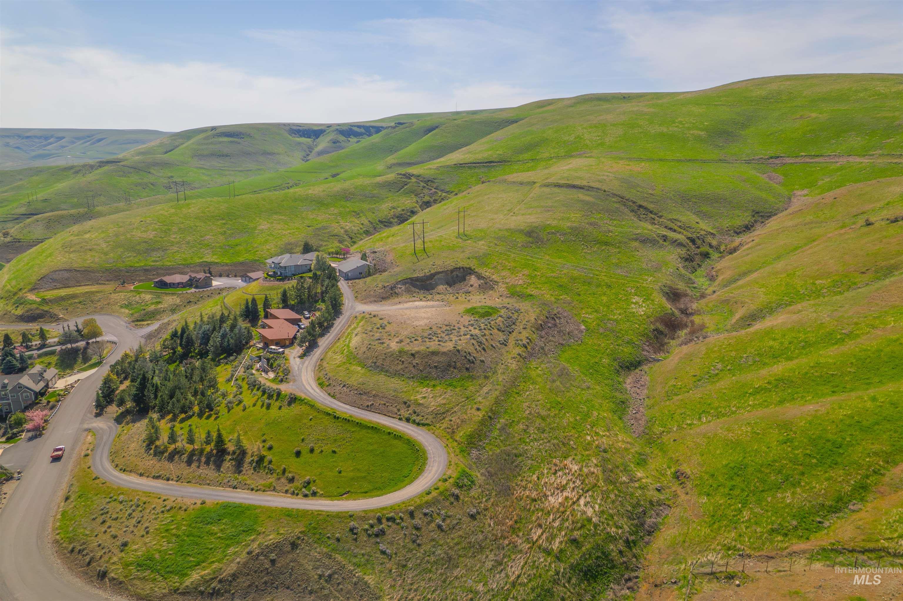 1780 Cherry Street Clarkston, WA 99403 - Photo 2 of 19 Aerial view of sparsely populated area featuring a mountainous background