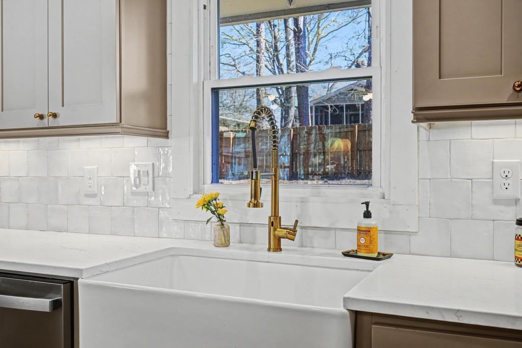 177 Kirkpatrick Drive Southwest Marietta, GA 30064 - Photo 12 of 37 a bathroom with a sink and a bathtub next to a window