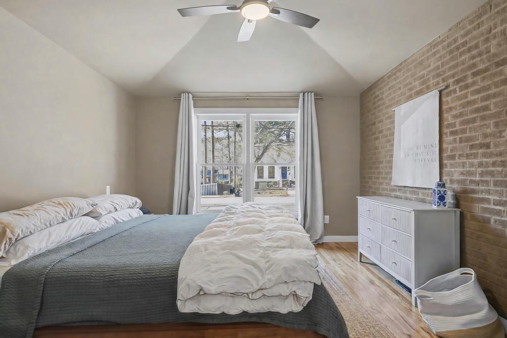 177 Kirkpatrick Drive Southwest Marietta, GA 30064 - Photo 16 of 37 a bedroom with a large bed and a chandelier