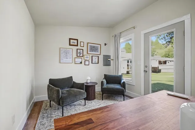 a living room with furniture and a table
