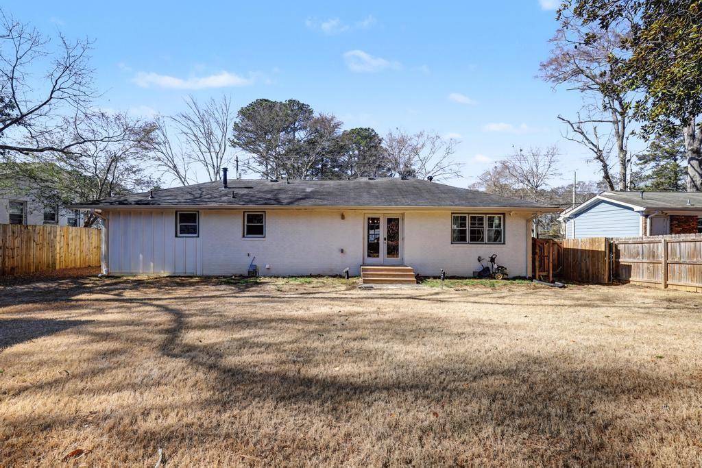 177 Kirkpatrick Drive Southwest Marietta, GA 30064 - Photo 28 of 37 a big house with a big yard and large trees