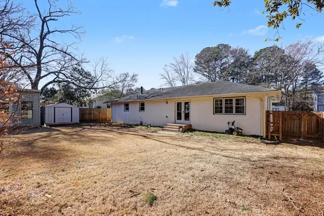 a view of a house with a snow in the yard