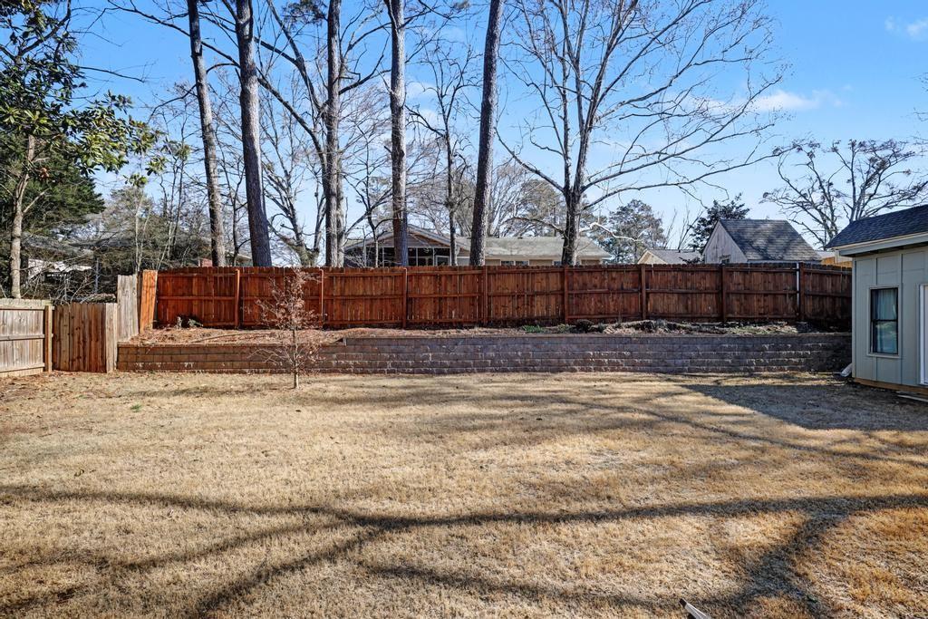 177 Kirkpatrick Drive Southwest Marietta, GA 30064 - Photo 30 of 37 a view of a yard with a bench