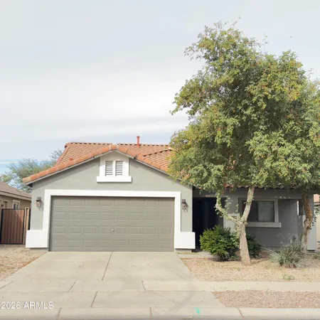 a front view of a house with garage