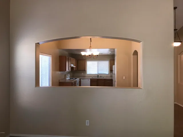 a view of a living room with a large window