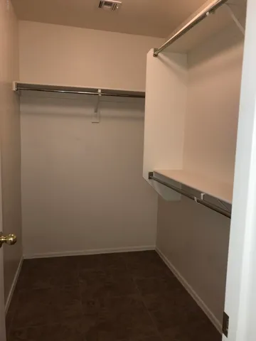 view of a room with rack on the wall