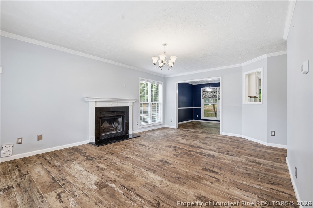 5113 Archer Road Hope Mills, NC 28348 - Photo 8 of 41 a view of an empty room with a window and fireplace