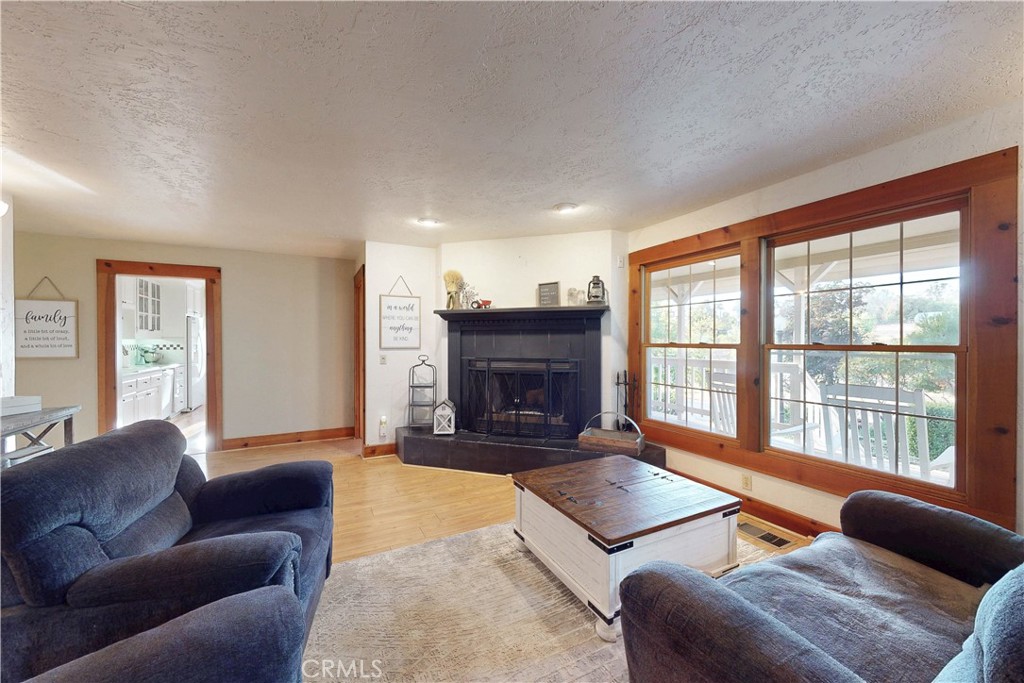 1473 Willow Road Nipomo, CA 93444 - Photo 14 of 52 a living room with furniture fireplace and a large window
