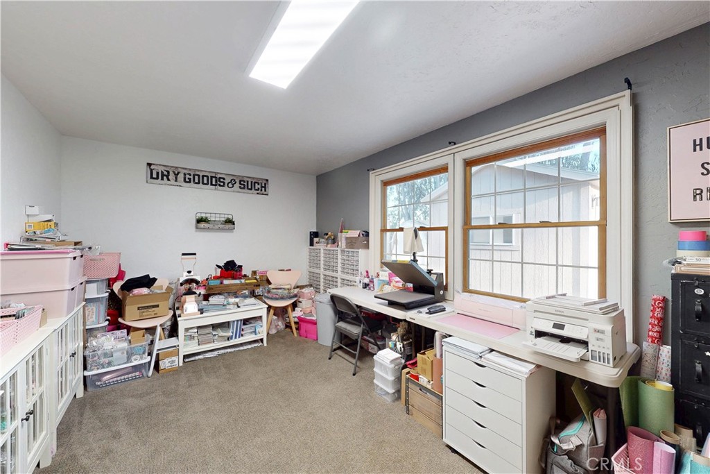1473 Willow Road Nipomo, CA 93444 - Photo 35 of 52 a view of a workspace with furniture and a window
