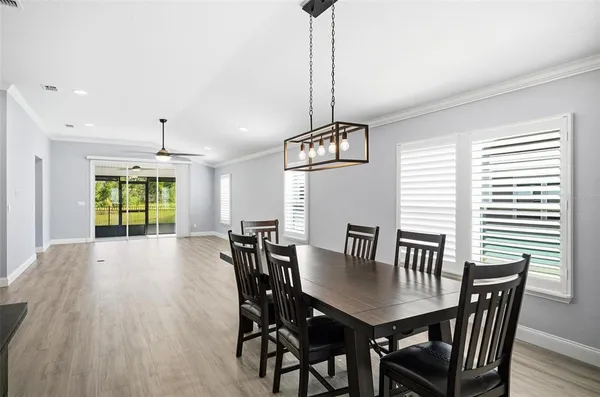 a view of a dining room with furniture window and outside view