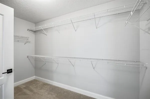 a view of a room with racks on the wall