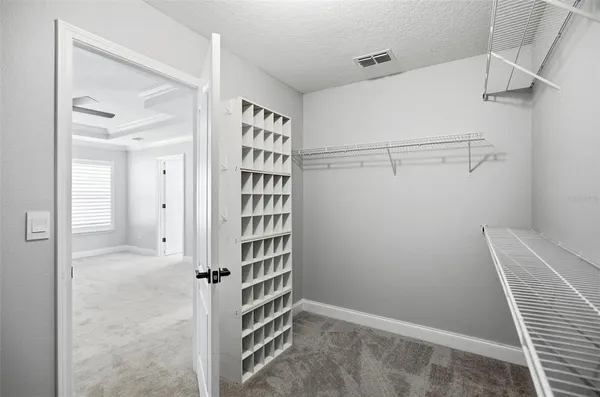 a view of wooden floor and cabinet in a room