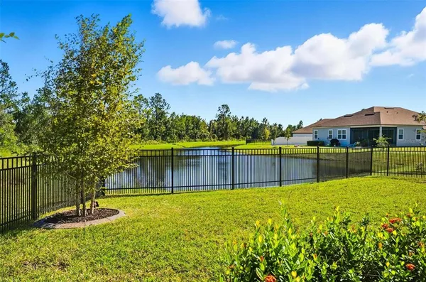 a view of swimming pool with a yard