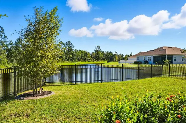 a view of swimming pool with a yard