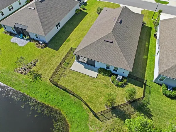 an aerial view of a house with a garden