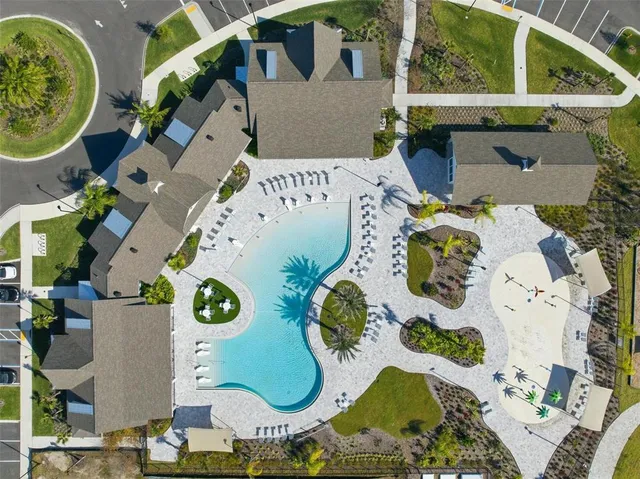 an aerial view of a house with a swimming pool