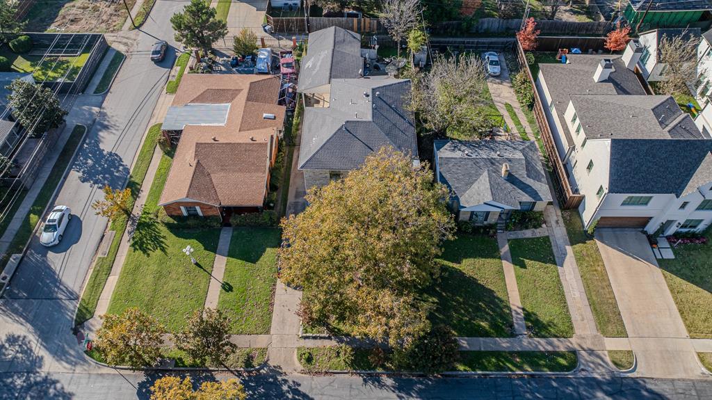 an aerial view of a house with outdoor space