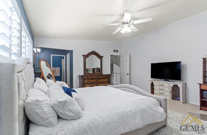 Undisclosed Address Bakersfield, CA 93309 - Photo 11 of 18 a bedroom with a bed and a flat screen tv