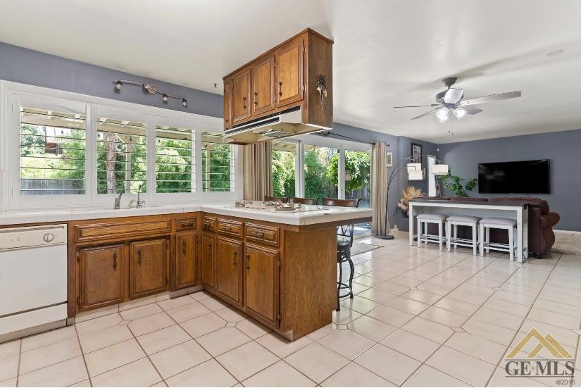Undisclosed Address Bakersfield, CA 93309 - Photo 16 of 18 a kitchen with stainless steel appliances granite countertop a stove a sink and a microwave