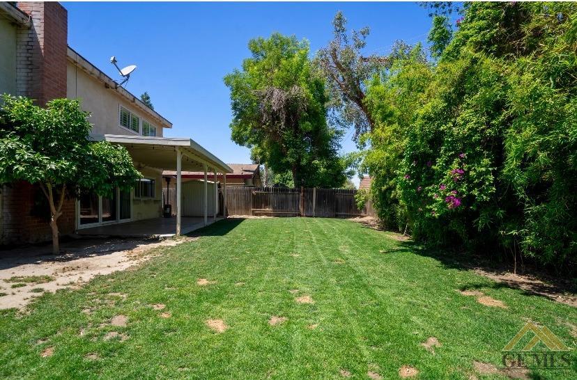 Undisclosed Address Bakersfield, CA 93309 - Photo 17 of 18 a view of a backyard with plants and a patio