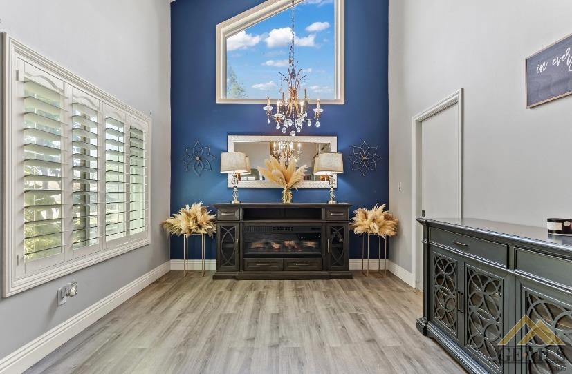 Undisclosed Address Bakersfield, CA 93309 - Photo 4 of 18 a living room with furniture a fireplace and a large window