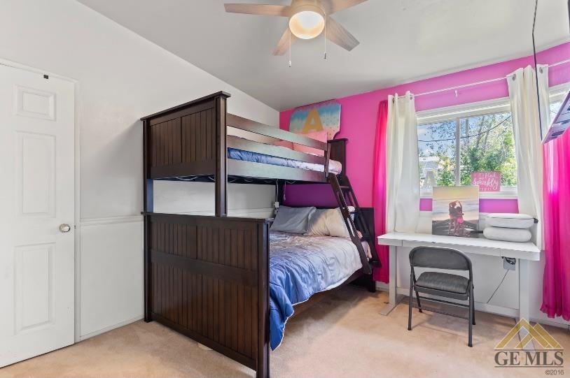 Undisclosed Address Bakersfield, CA 93309 - Photo 8 of 18 a bedroom with a bed and a window