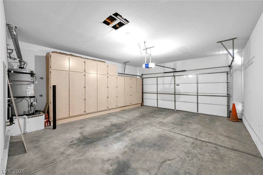 10730 Amber Ridge Drive, Unit 101 Las Vegas, NV 89144 - Photo 29 of 32 Secure parking and ample storage in this well-appointed garage.