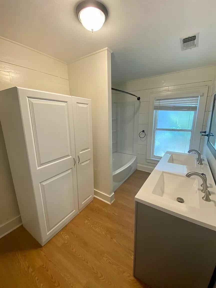 2109 22nd Street, Unit FRONT Lubbock, TX 79411 - Photo 12 of 16 a storage utility room with a sink
