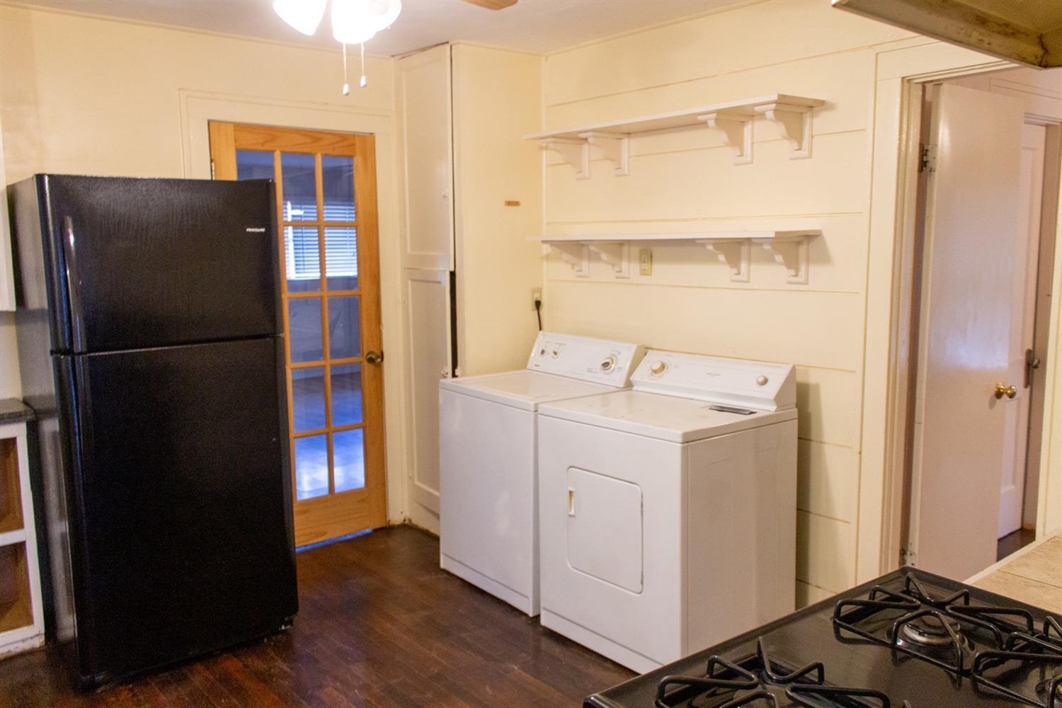 2109 22nd Street, Unit FRONT Lubbock, TX 79411 - Photo 5 of 16 a utility room with dryer and washer