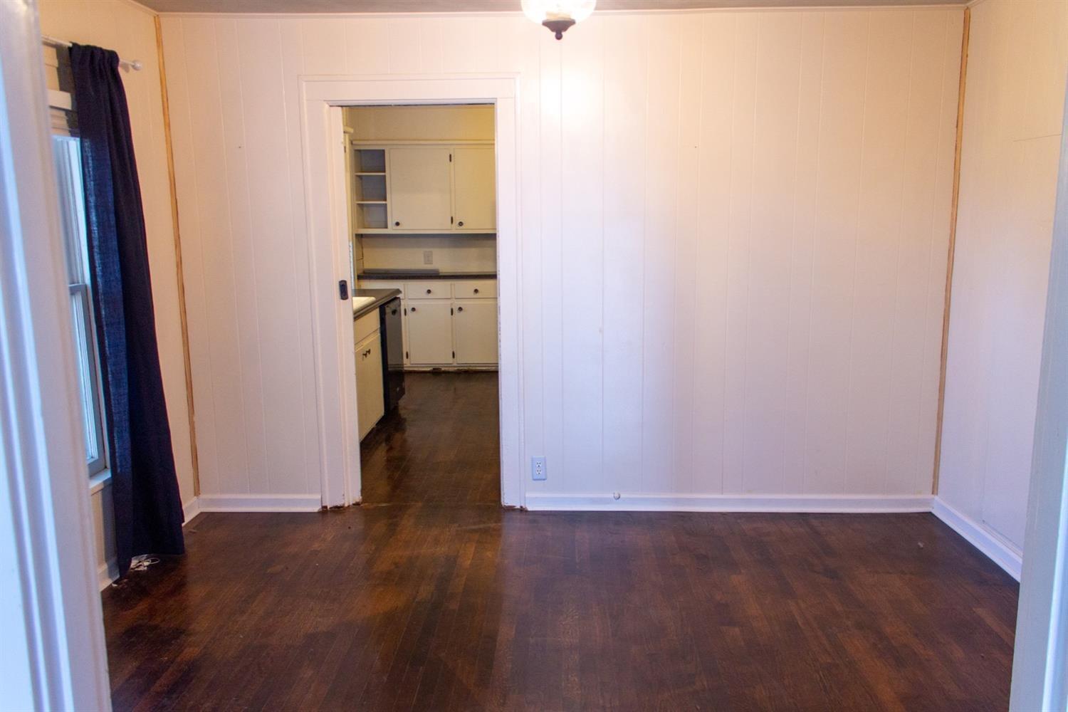 2109 22nd Street, Unit FRONT Lubbock, TX 79411 - Photo 9 of 16 an empty room with wooden floor and bathroom