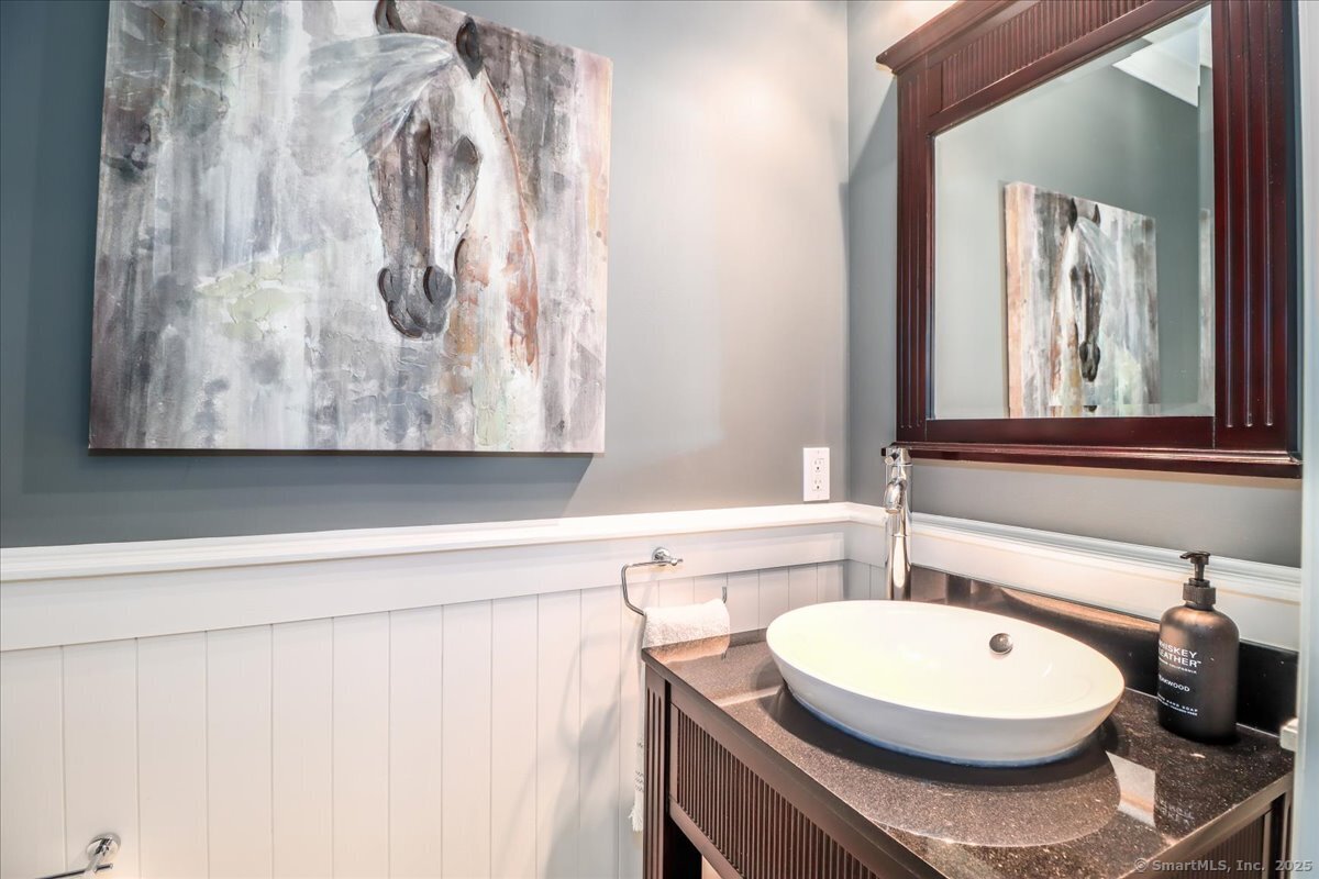 81 Graenest Ridge Road Wilton, CT 06897 - Photo 12 of 39 a bathroom with a toilet and a sink